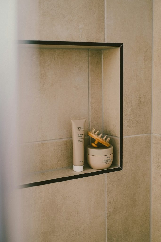bathroom-products-sit-inside-a-tiled-niche-eska7ajdauo